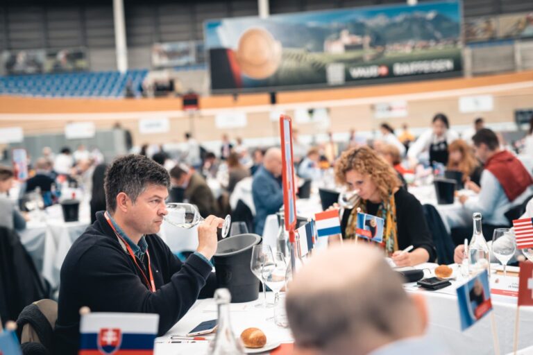 Judges smelling white wine in the contest tasting room